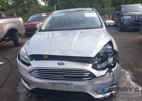 2016 Ford Focus Titanium z USA, uszkodzony, nr VIN 1FADP3N25GL250227